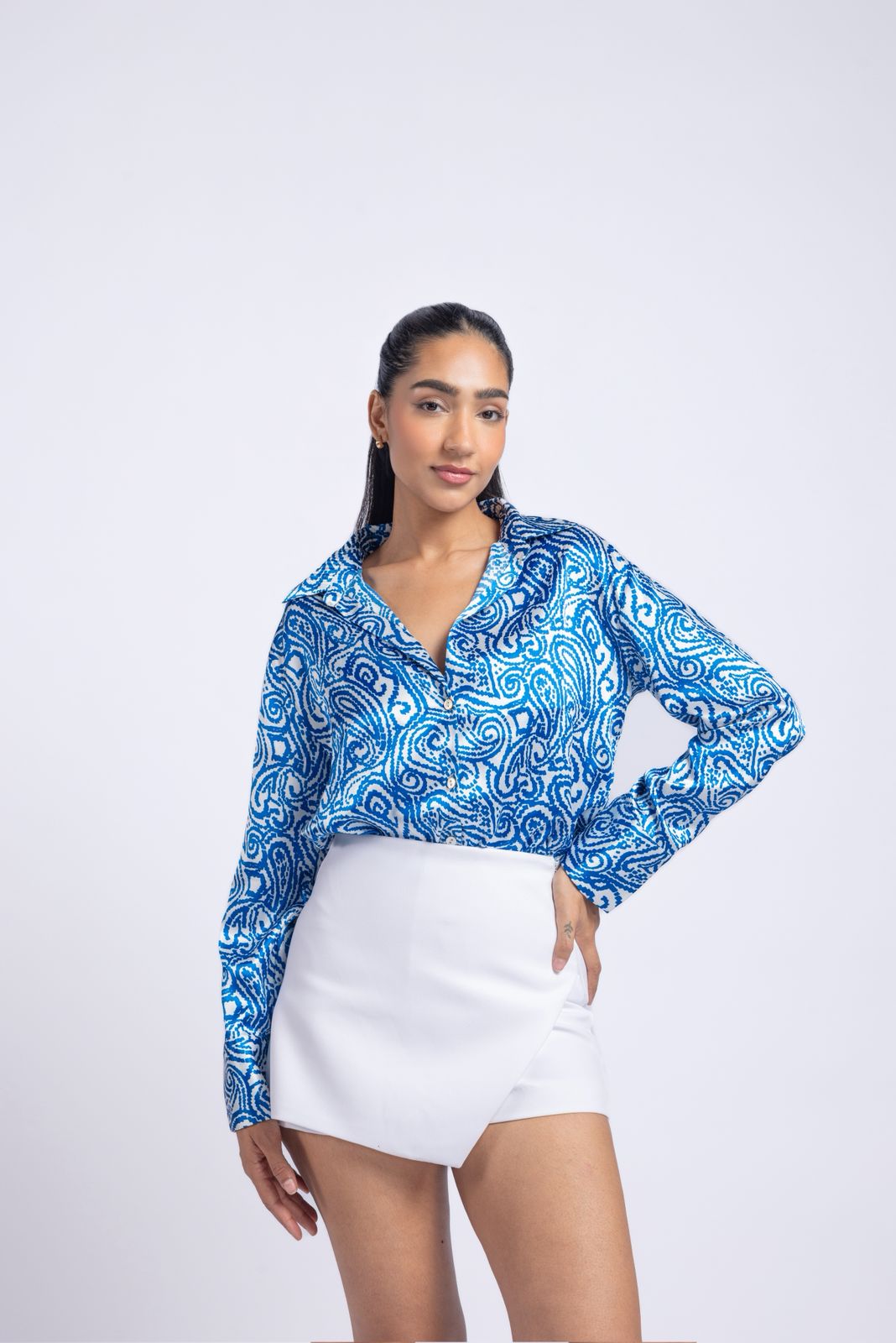 Blue satin shirt with a printed pattern.