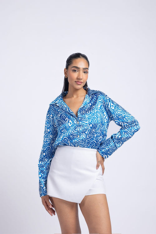Blue satin shirt with a printed pattern.